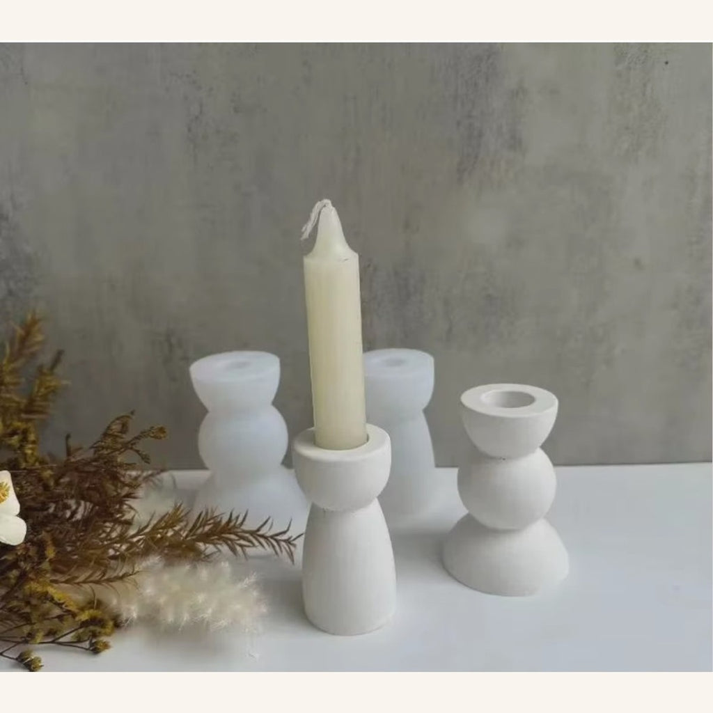 White geometric candle holders with taper candle, finished-piece inspiration